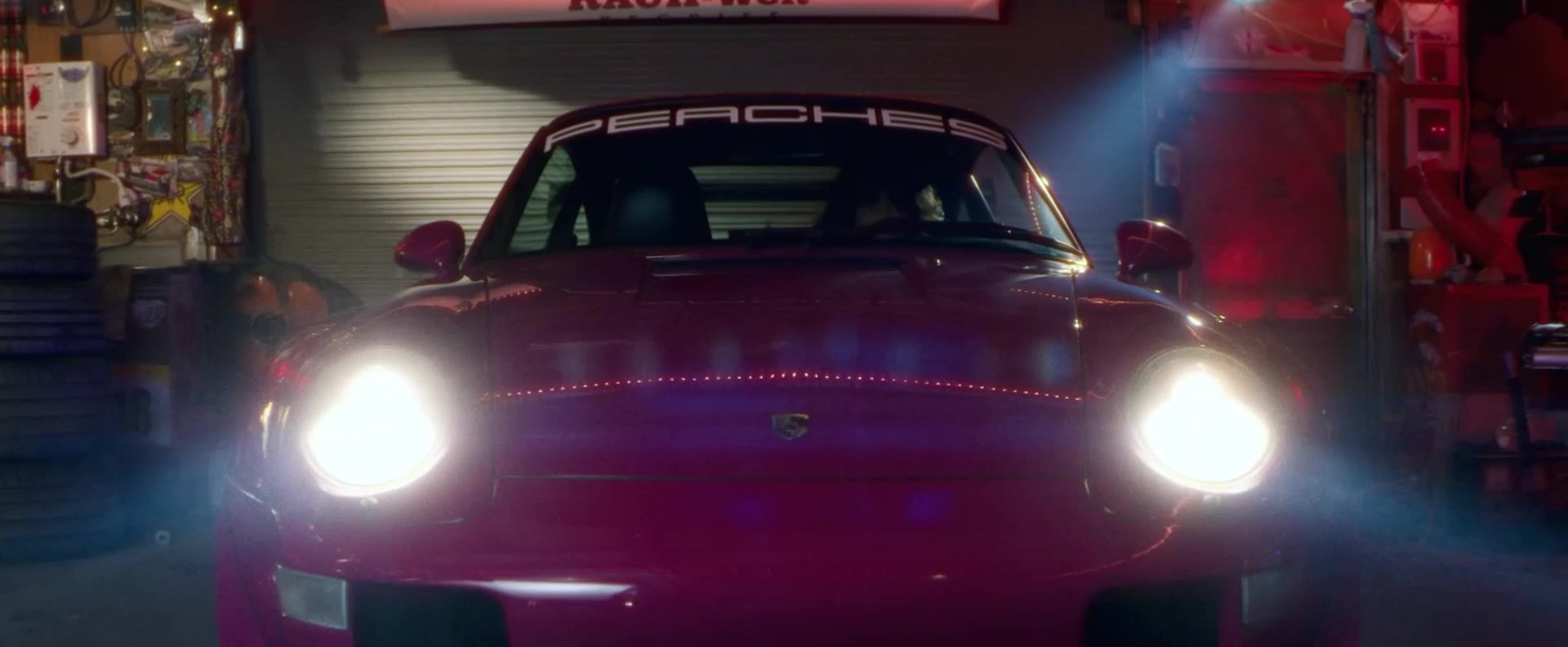 RWB Batto with its headlights on inside the RWB workshop